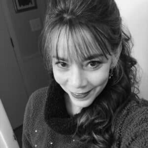 Tina Thaw Photo of a middle-aged woman, Tina, who is CEO of Thawland. The photo is black and white, and Tina is wearing a sweater with her hair pulled half up with bangs across her forehead.